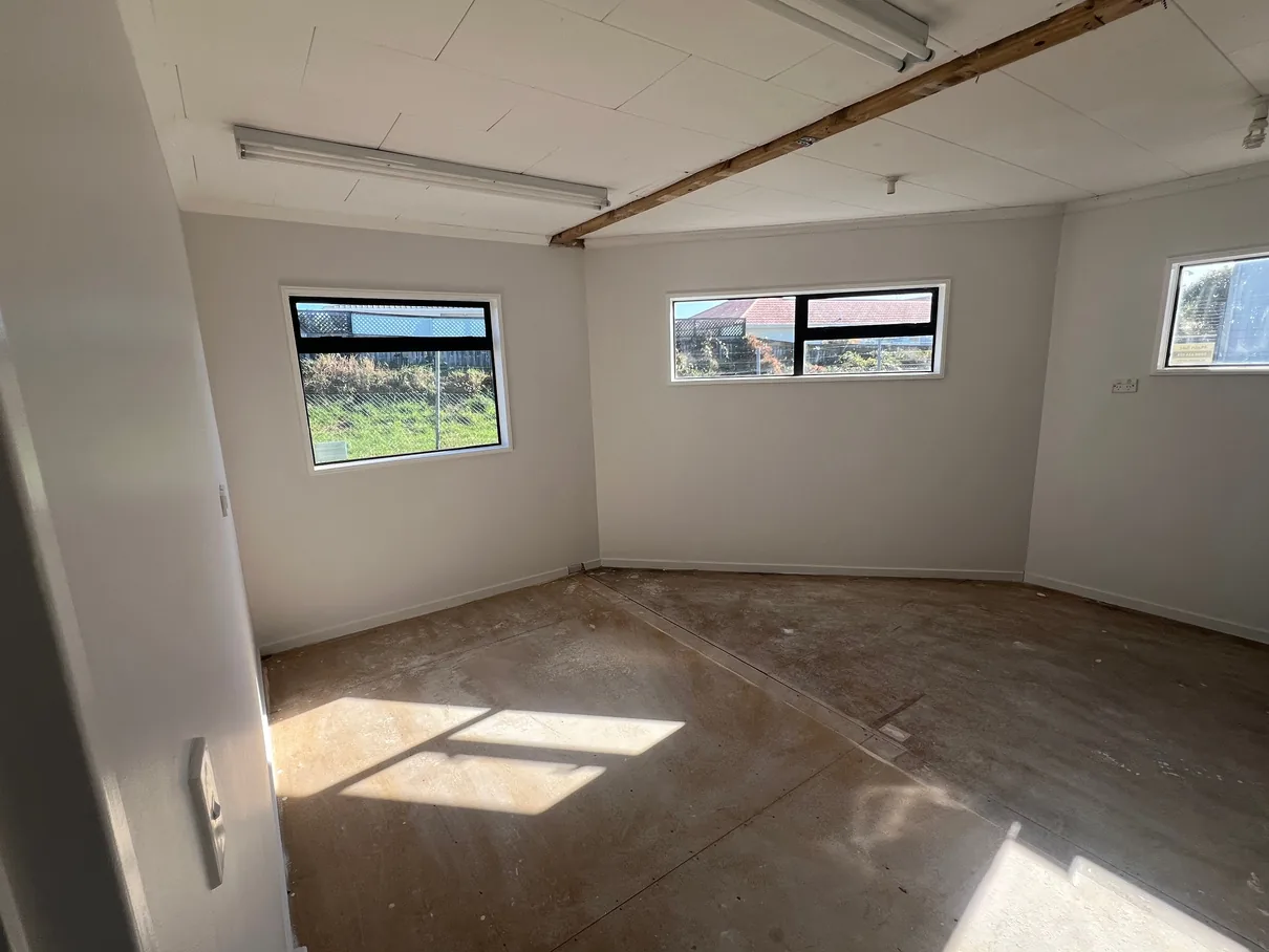 Light-painted walls in an empty room.